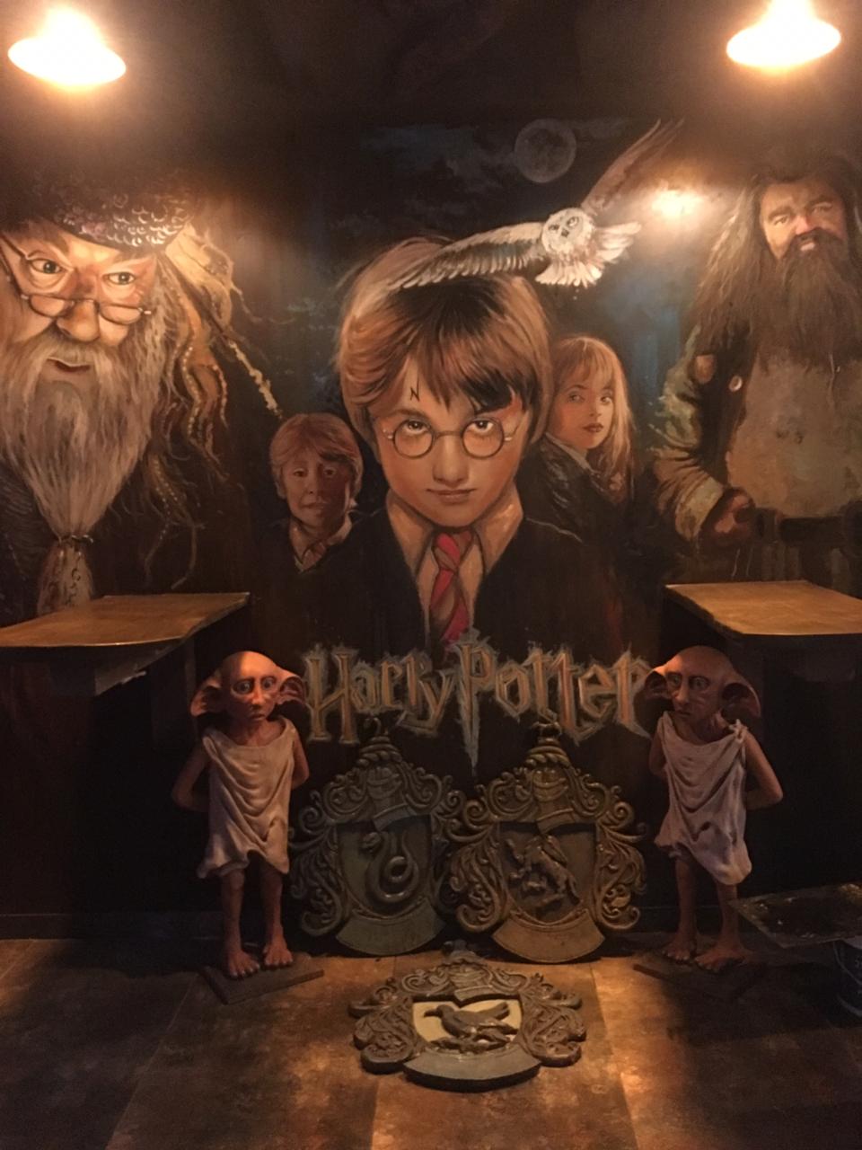 Themed mural and sculpture installation by Liger Art